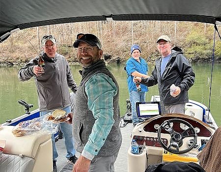 fishermen eating luunch aboard boat