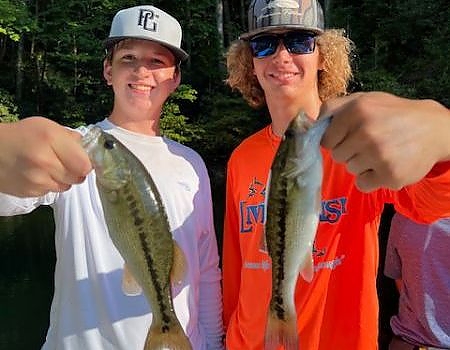 Two teens pose with catches