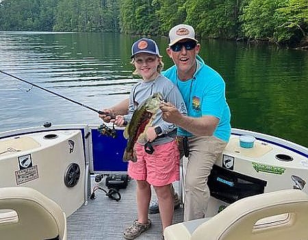 Father and son pose during Blue Ridge fly-fishing trip